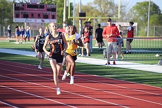 Fulton's Chazlyn Long (yellow) dashes to the finish line in the Mexico Middle School Relays Wednesday at Mexico High School in Mexico, Missouri. (Danuser Photography/Courtesy)